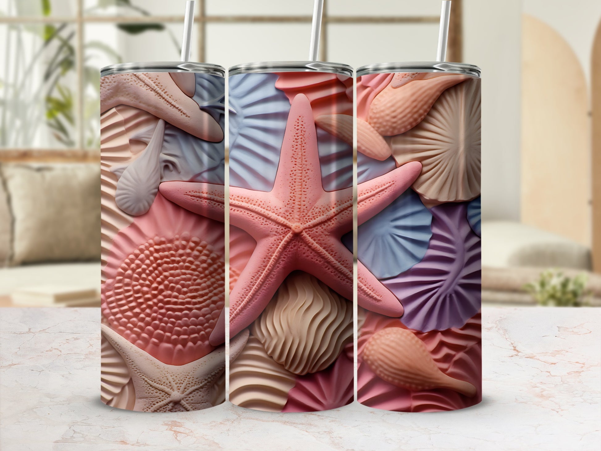Three tumblers showcasing a detailed seashell and starfish pattern.