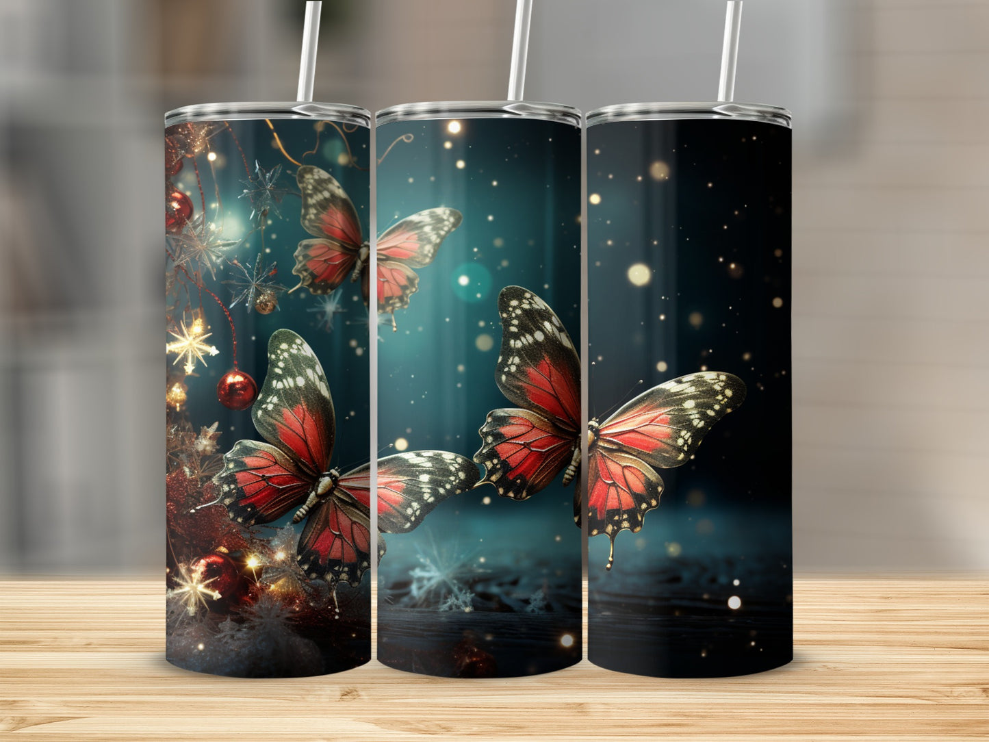 Three tumblers with red butterflies and holiday lights.