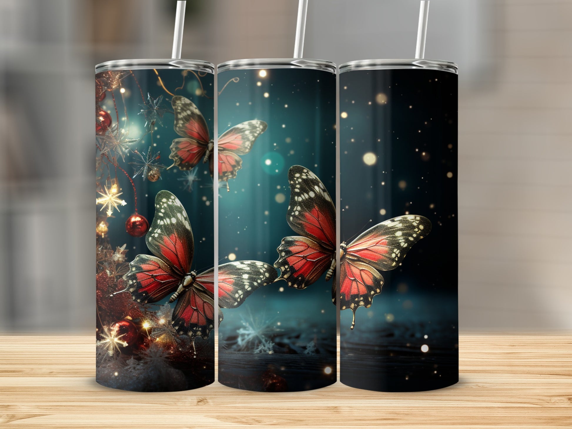 Three tumblers with red butterflies and holiday lights.
