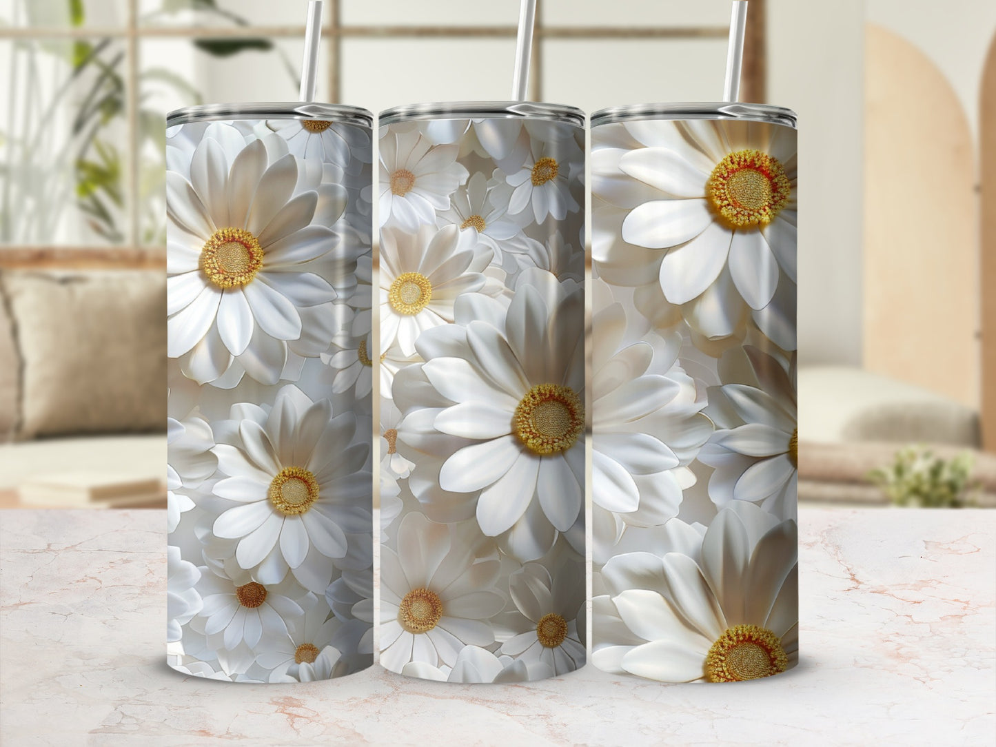 Three tumblers with white daisy floral pattern and straws.