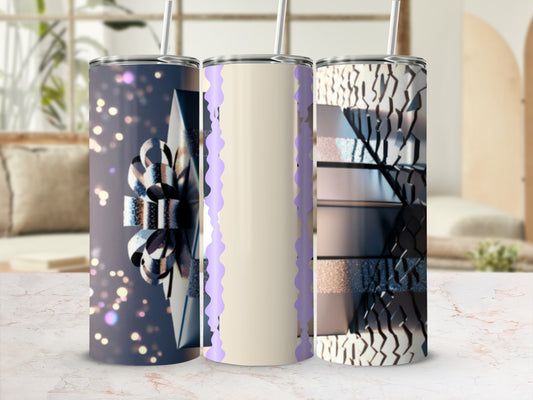 Three tumblers with abstract designs and straw, displayed on a marble surface.