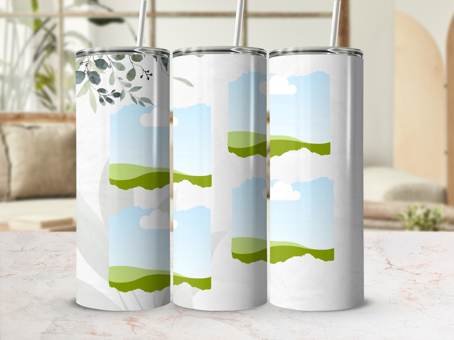 Three tumblers with torn paper effects revealing green hills and sky.
