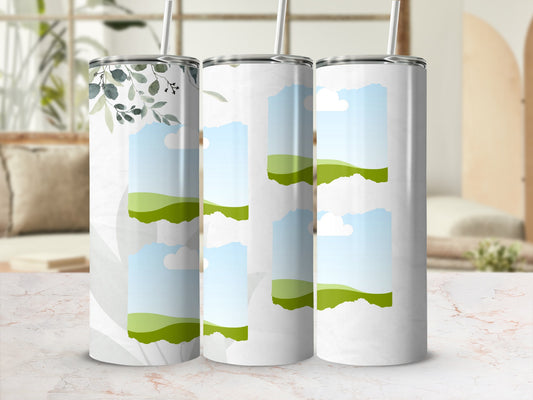 Three tumblers with torn paper effects revealing green hills and sky.