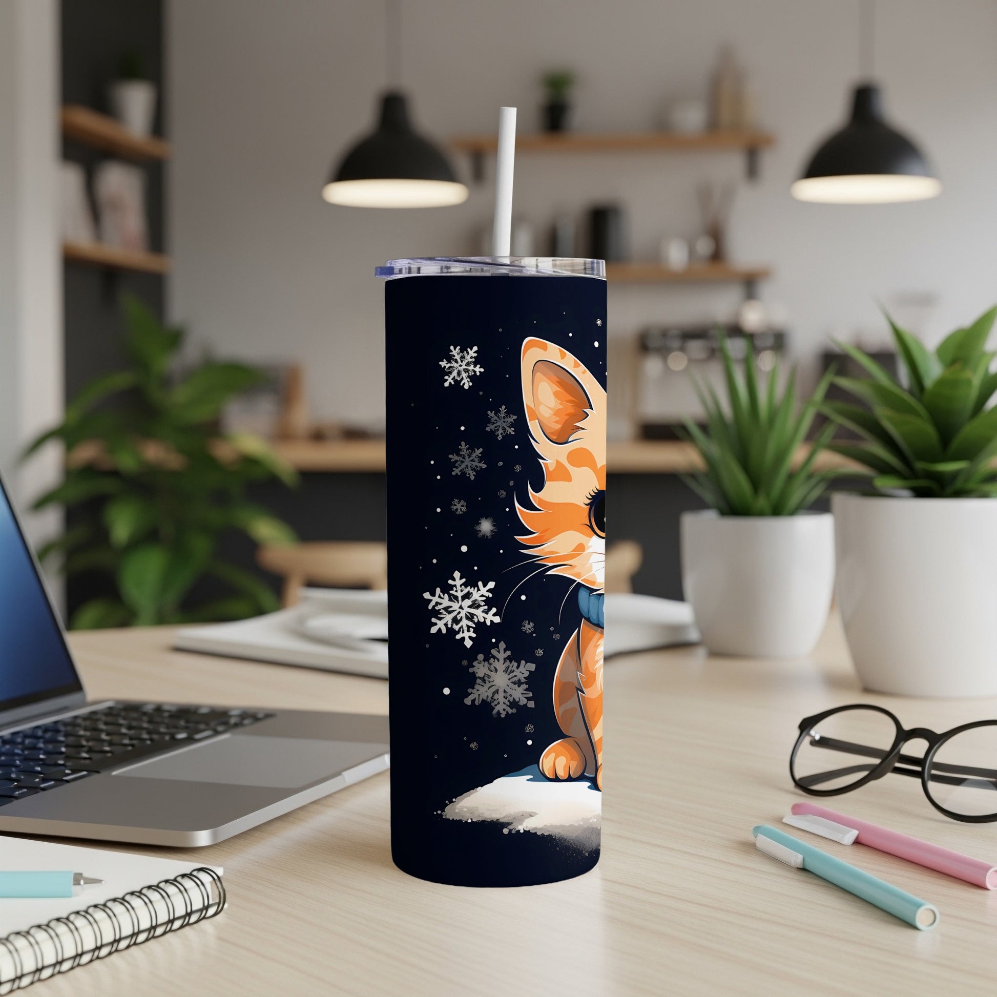 Cartoon cat with snowflakes on a dark tumbler with a straw.