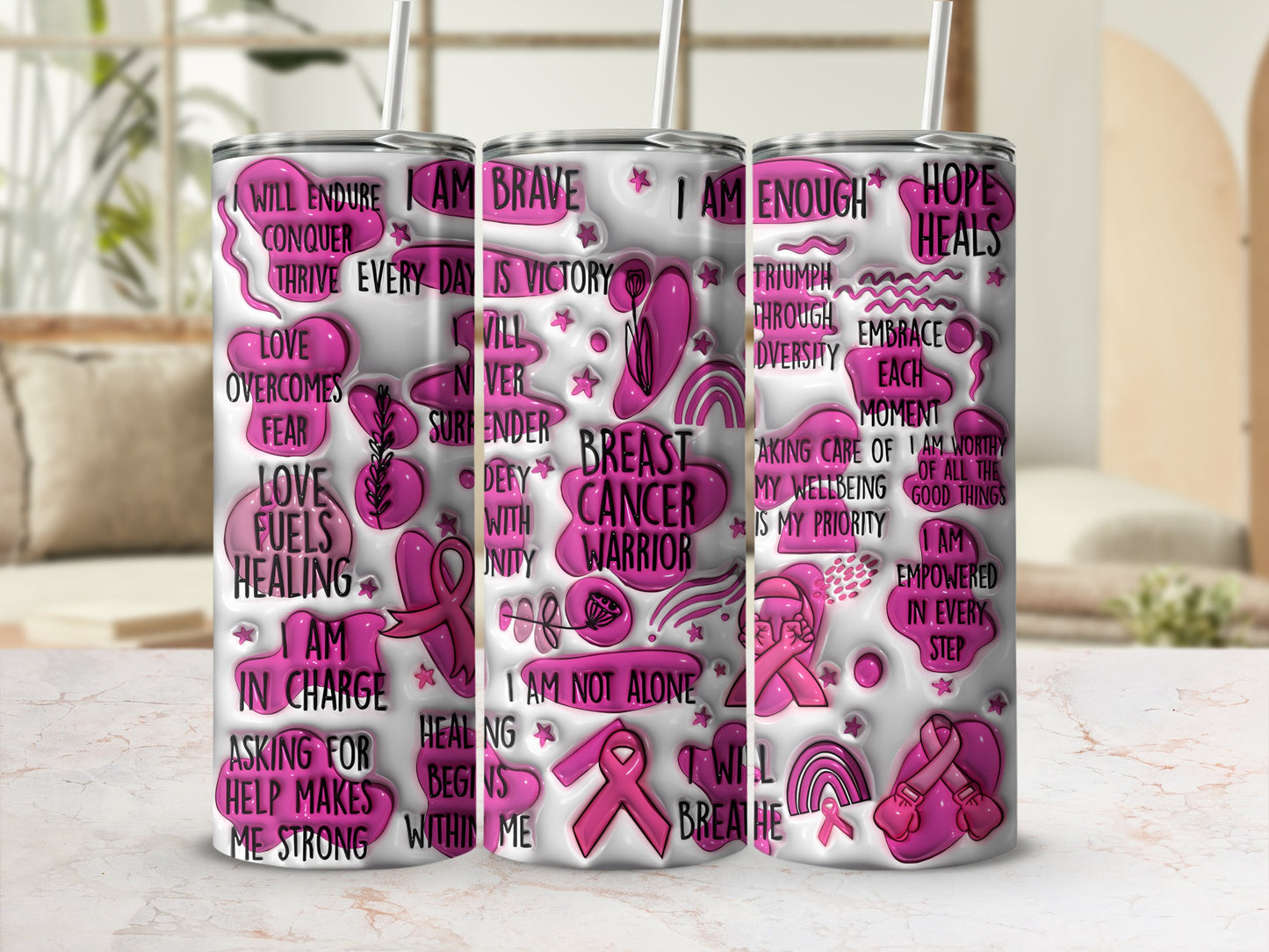Three tumblers with inspirational text and pink ribbons for breast cancer awareness.