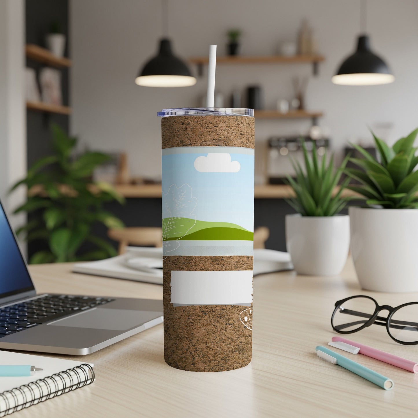Cork tumbler with a nature scene design and a white label.