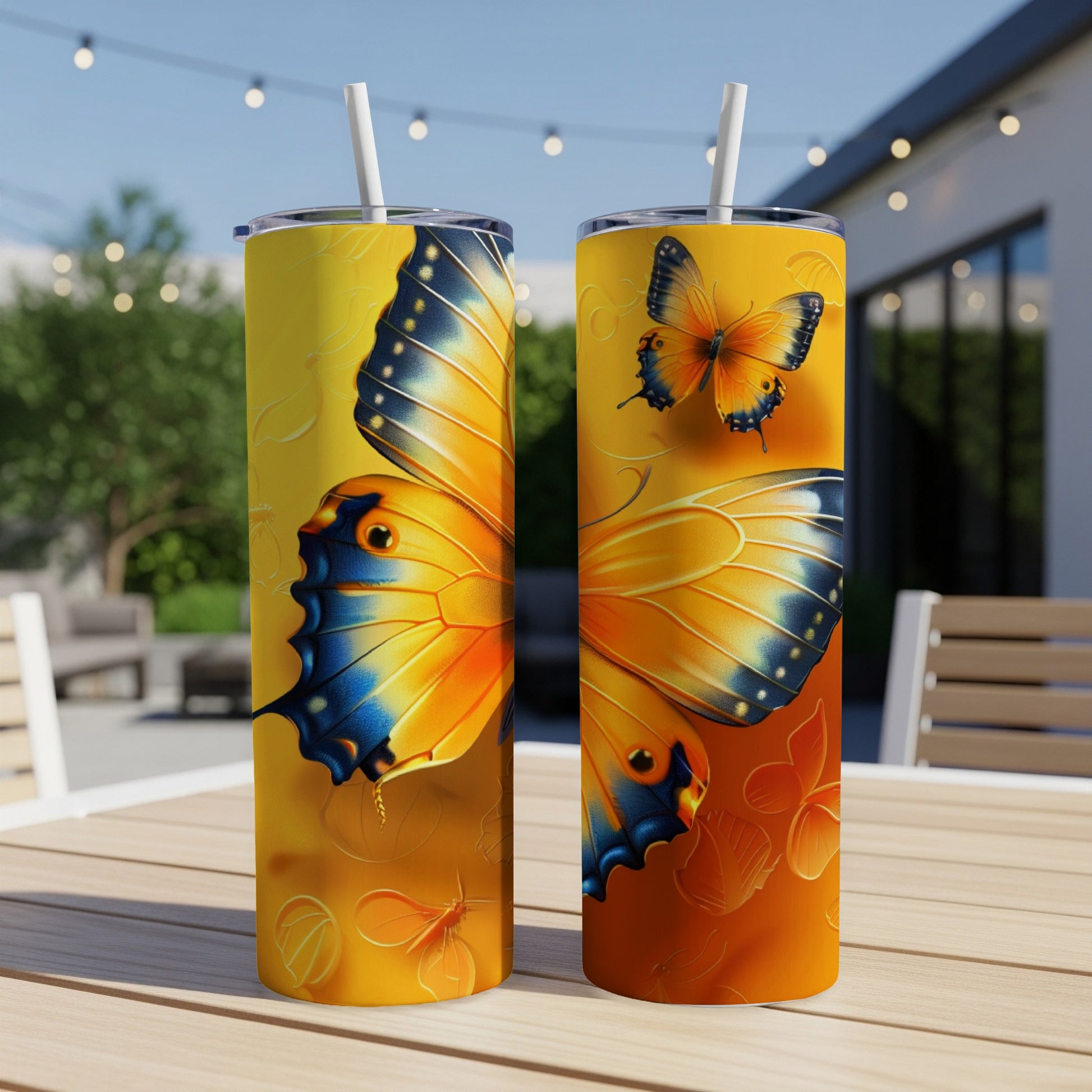 Two tumblers featuring a large orange and blue butterfly design.