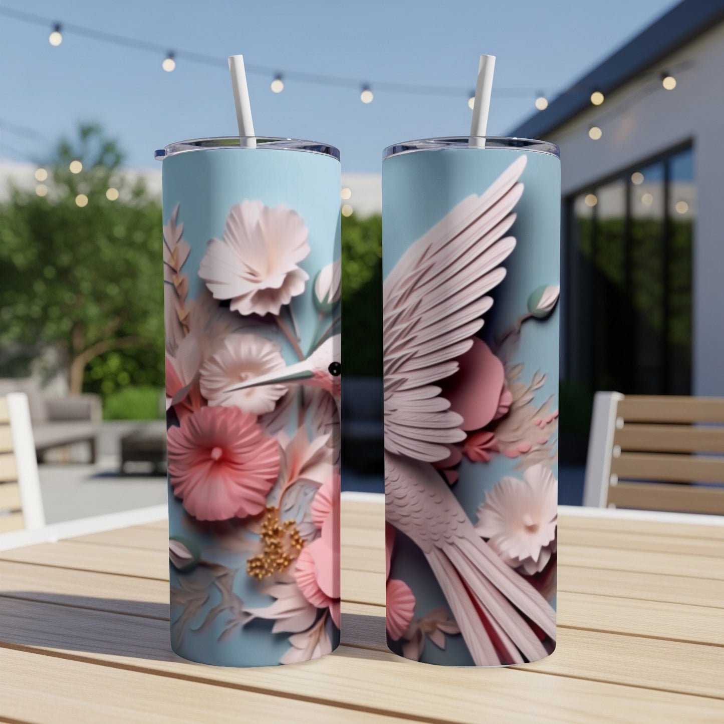Two light blue tumblers with pink floral and hummingbird designs.