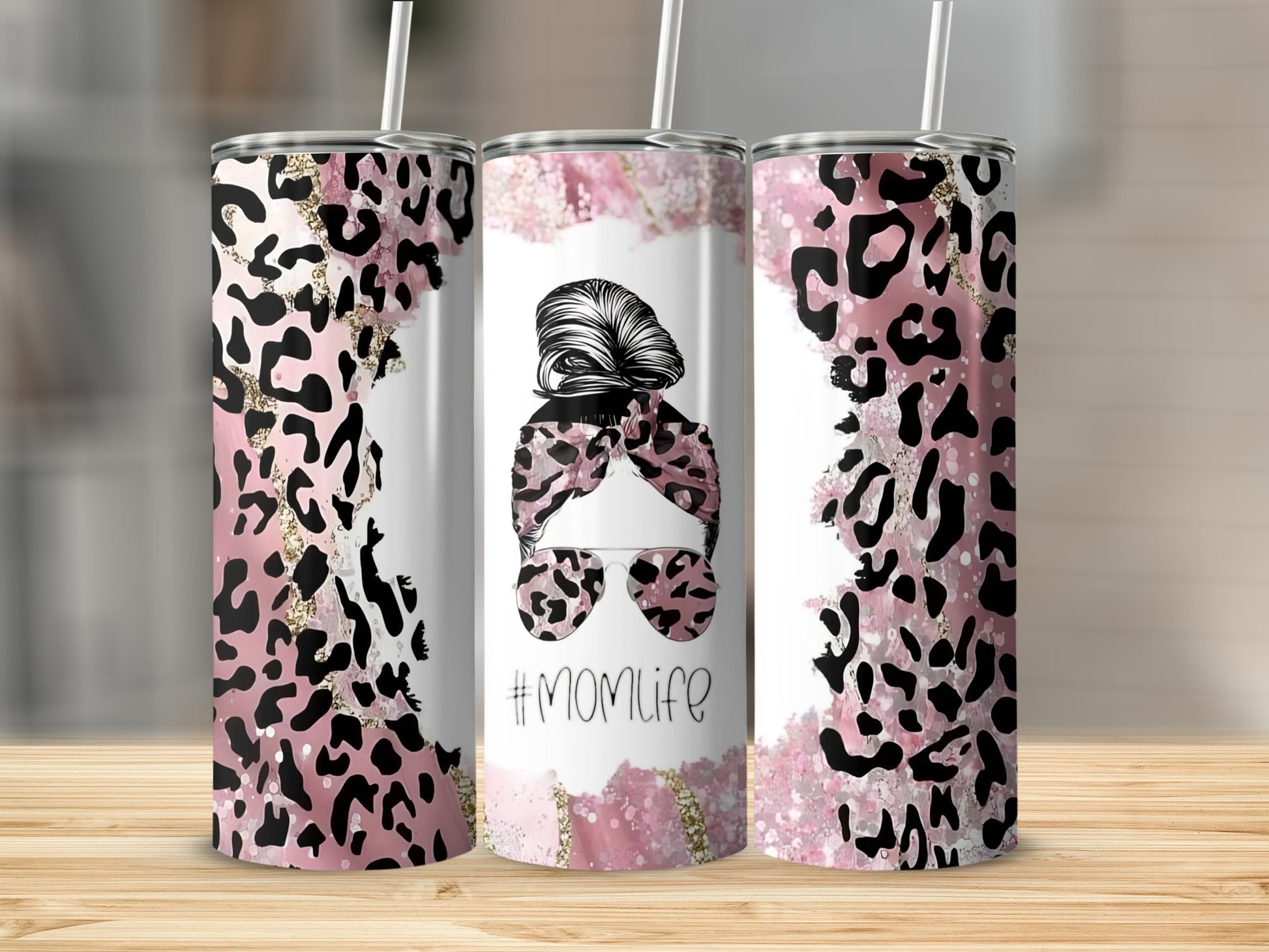 Pink leopard print tumbler with "#Momlife" text and messy bun graphic.
