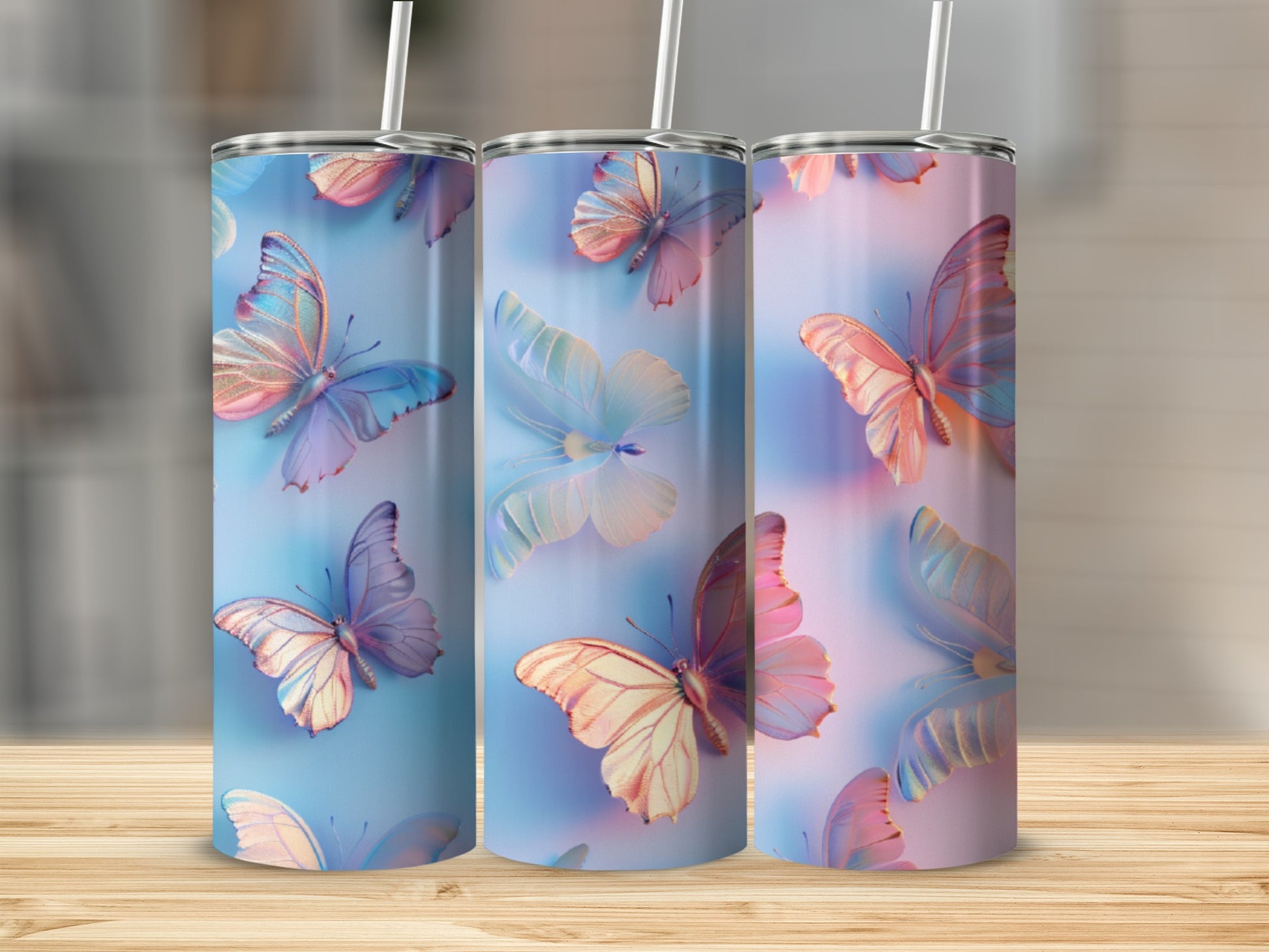 Three tumblers featuring iridescent butterflies on a gradient background.