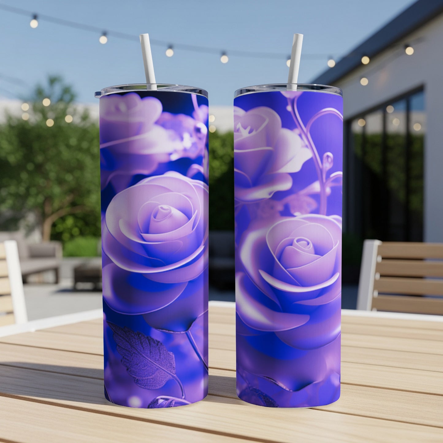 Two purple floral tumblers with straws on a wooden table.