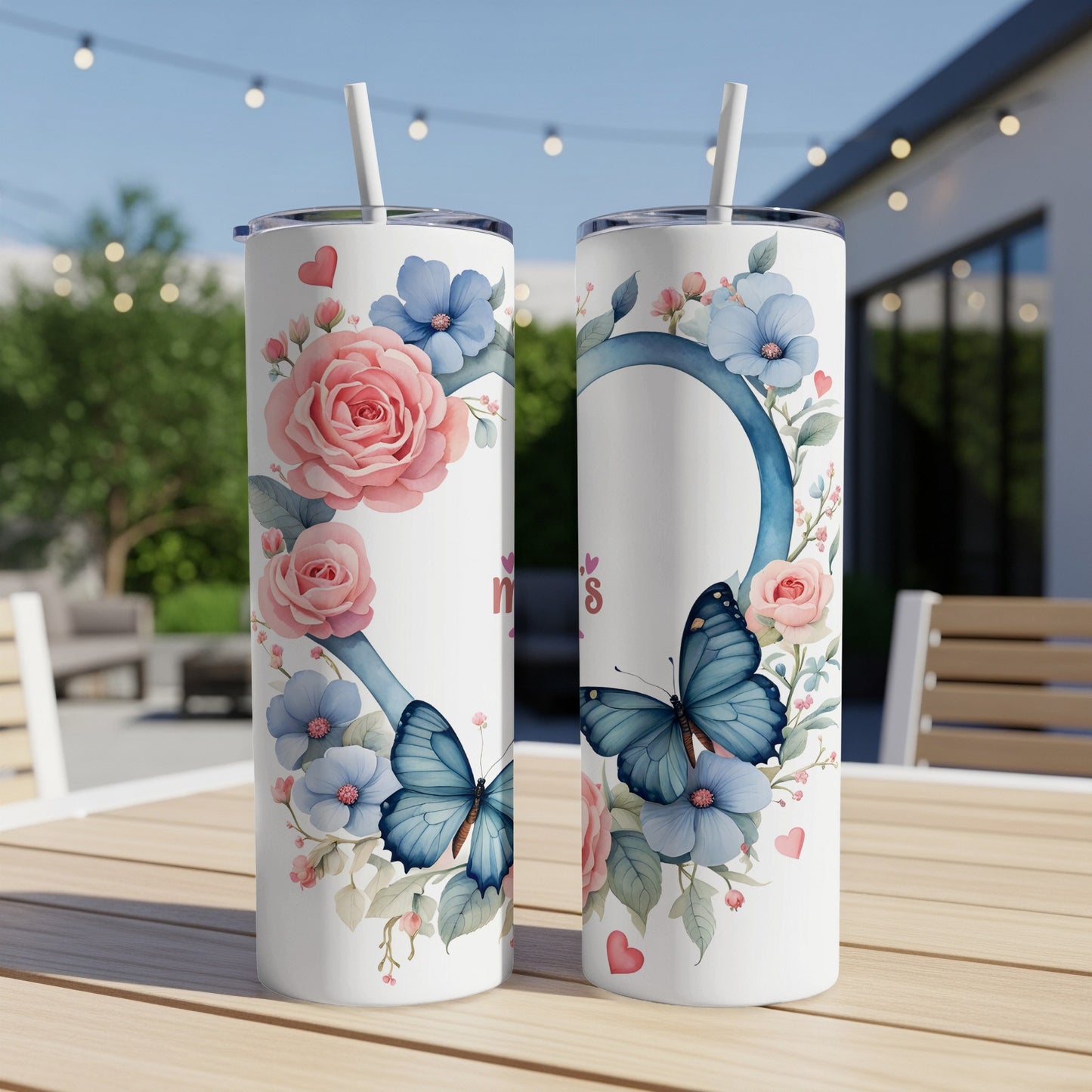 Two tall tumblers with floral and butterfly designs, one showing "Mom's" text.