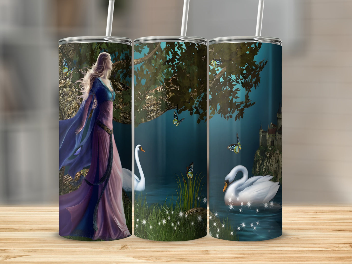 Fantasy scene with woman, swans, and castle on three tumblers.