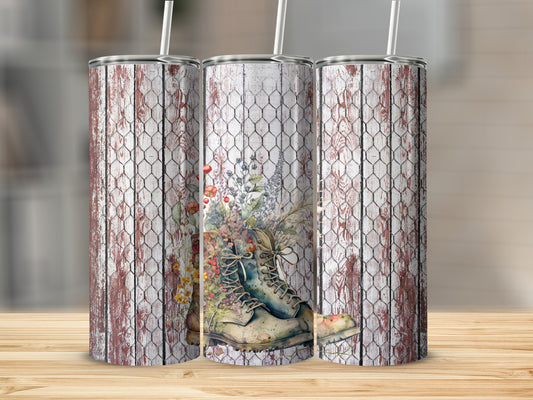 Floral boot design on three insulated tumblers with straw.