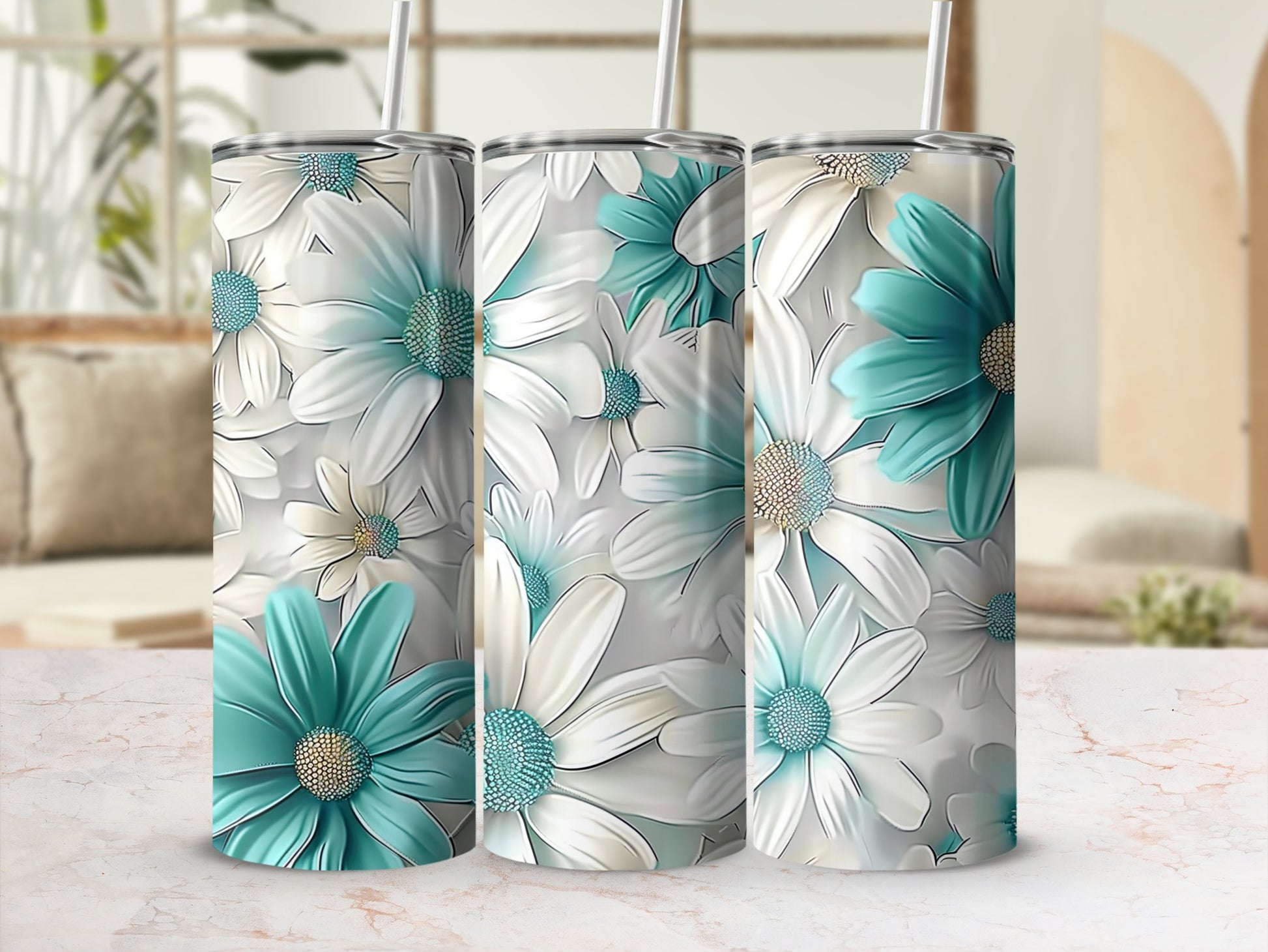 Three tumblers with white and teal daisy floral pattern.