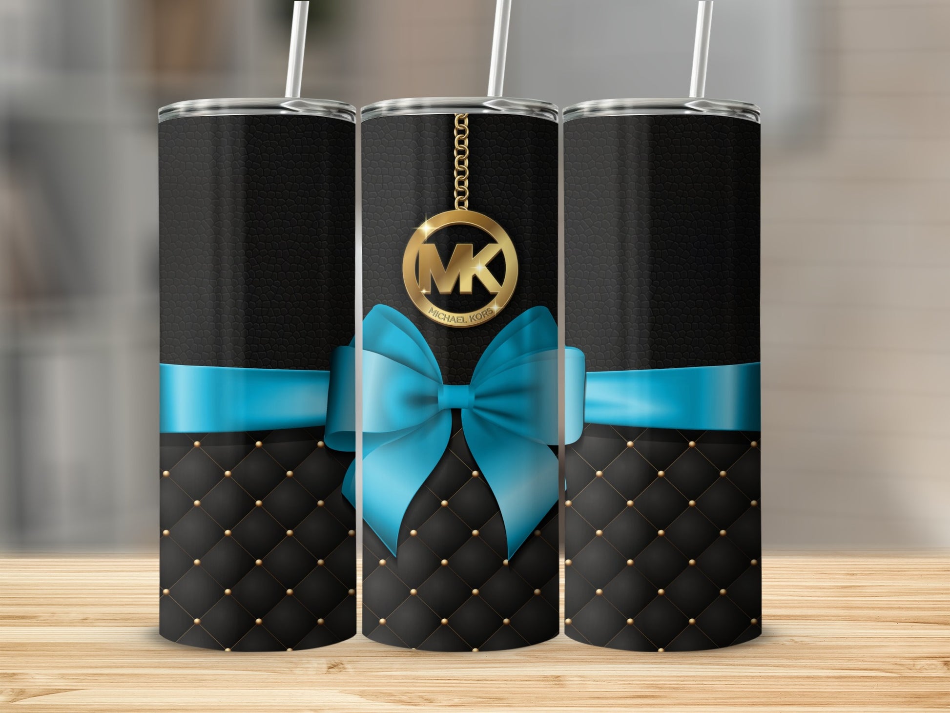Black and Blue Tumbler with Gold MK Logo Design