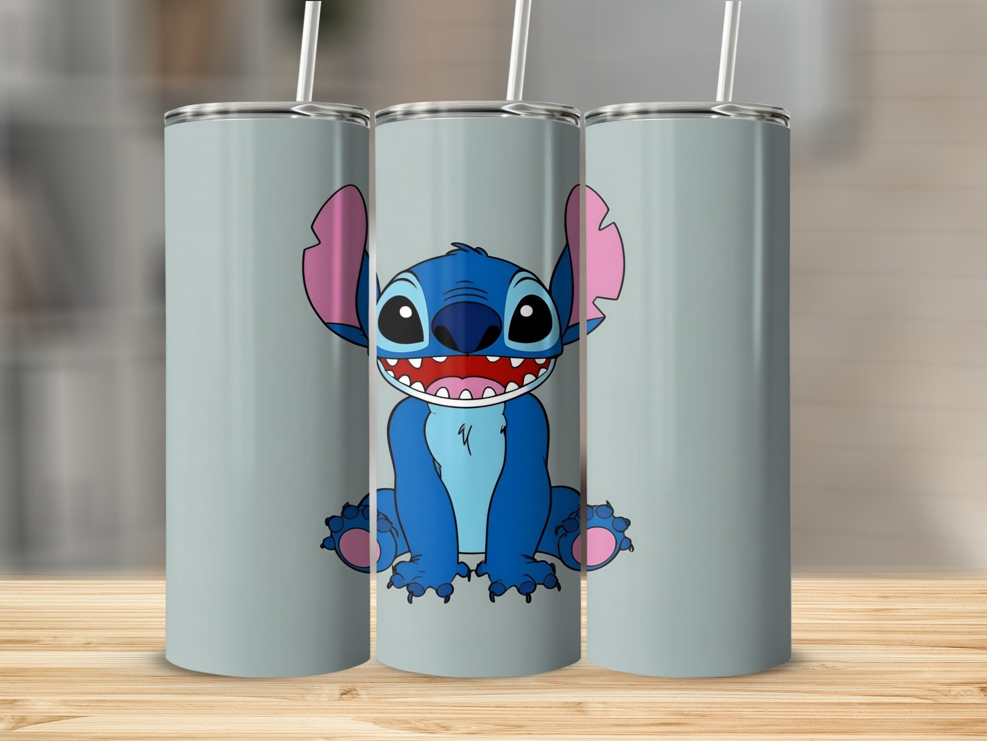 Blue Stitch character with big ears and wide smile on a grey tumbler.