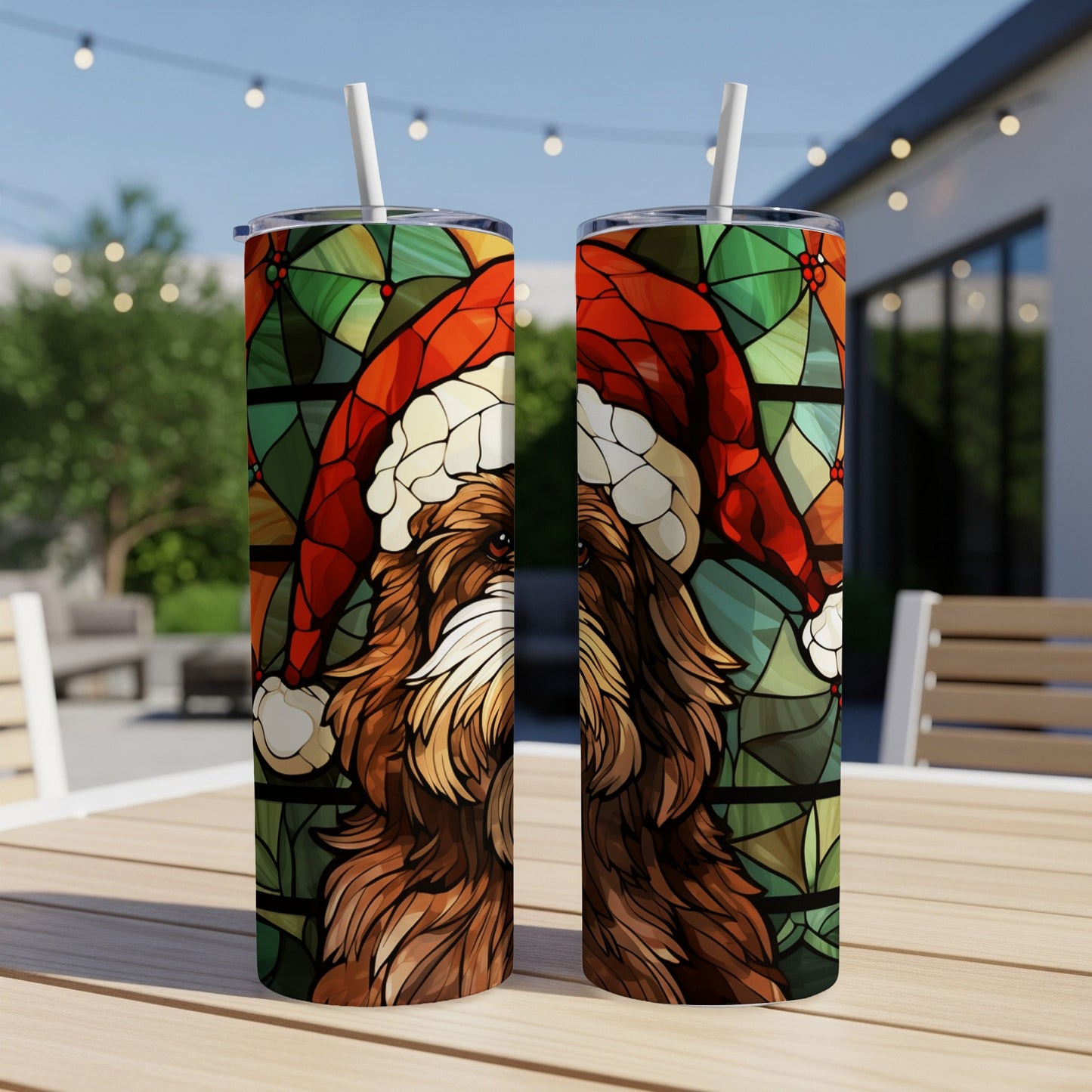 Two tumblers featuring stained-glass dog with Santa hat in outdoor setting.