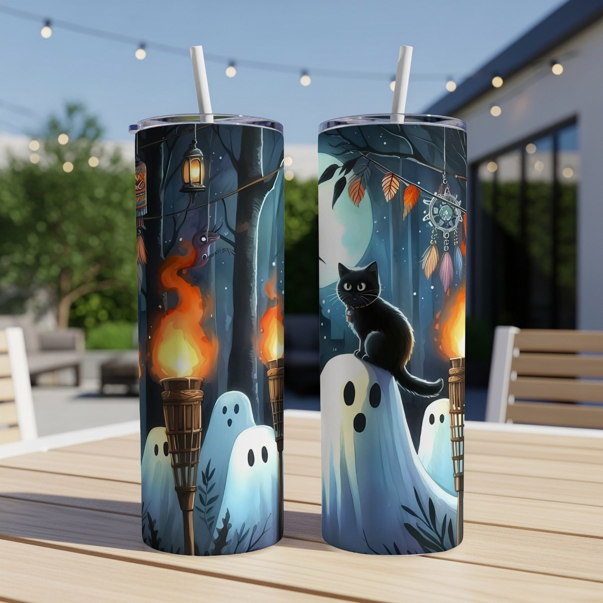 Two tumblers with a spooky Halloween design featuring a black cat, ghosts, and torches.