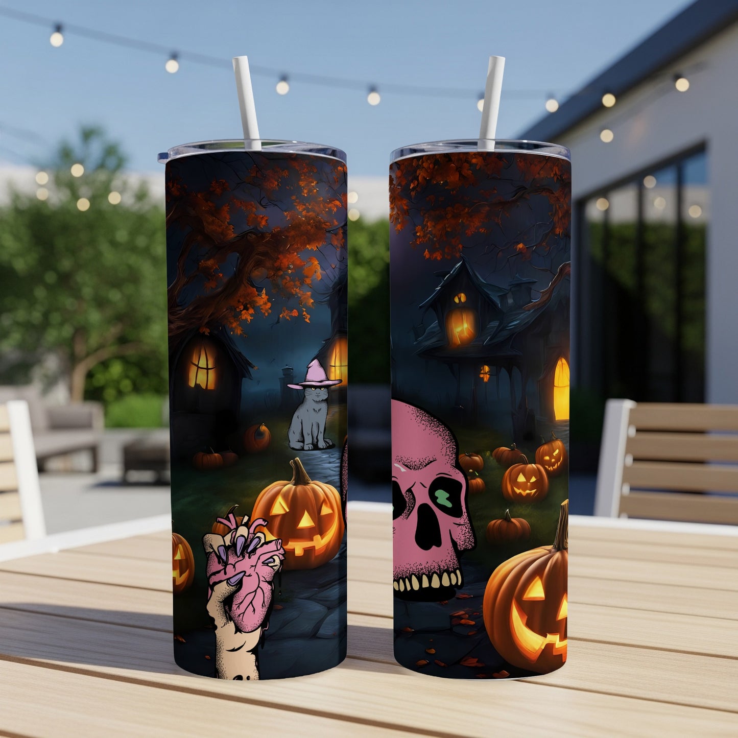 Two Halloween-themed tumblers with spooky designs of skulls, pumpkins, and haunted houses.