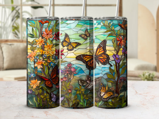 Three tumblers with stained-glass butterfly and floral designs.