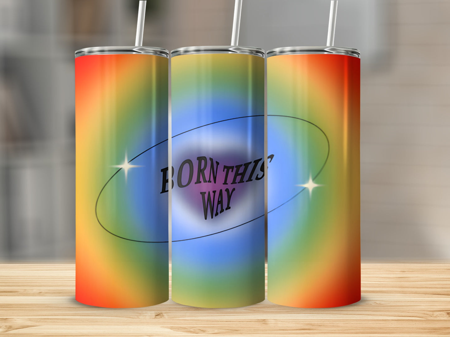 Rainbow gradient tumbler with "Born This Way" text in oval.