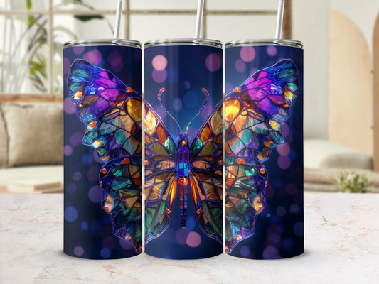 Stained glass butterfly design on three tumblers with bokeh background.