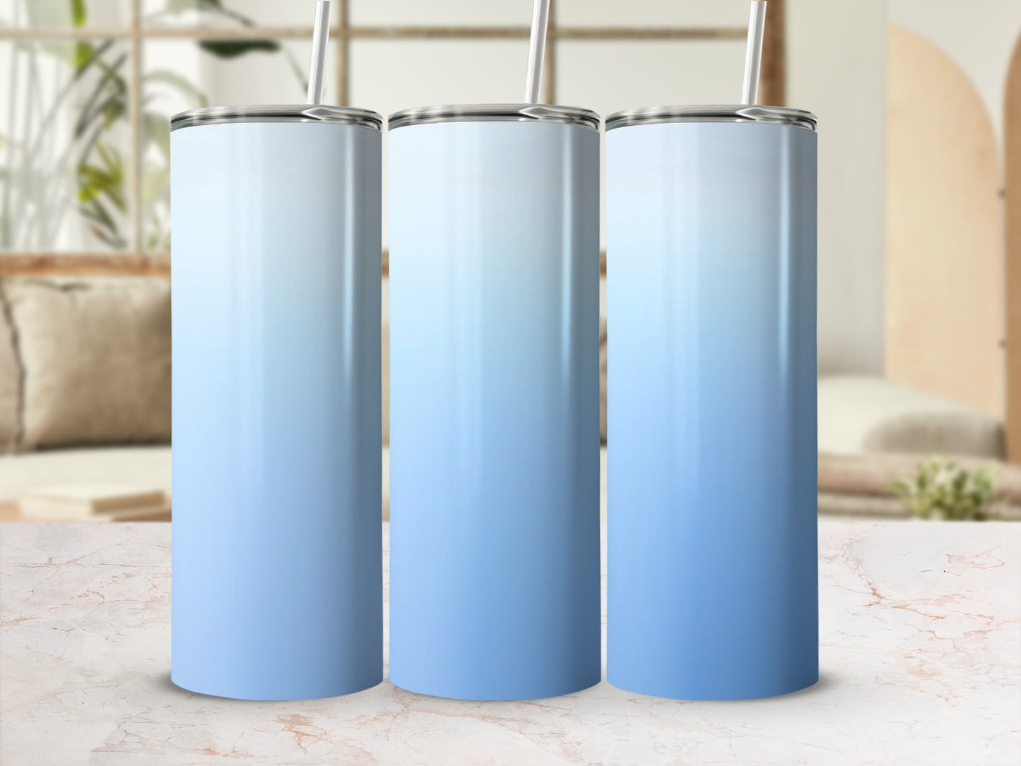Three gradient tumblers with white lids and silver straws.