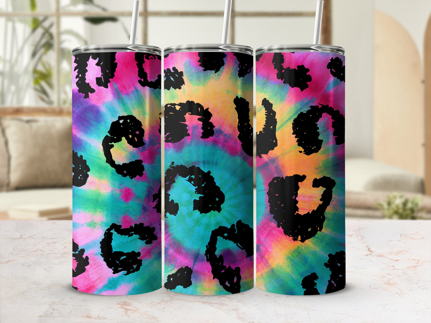 Three tumblers with a colorful tie-dye pattern and black leopard spots.