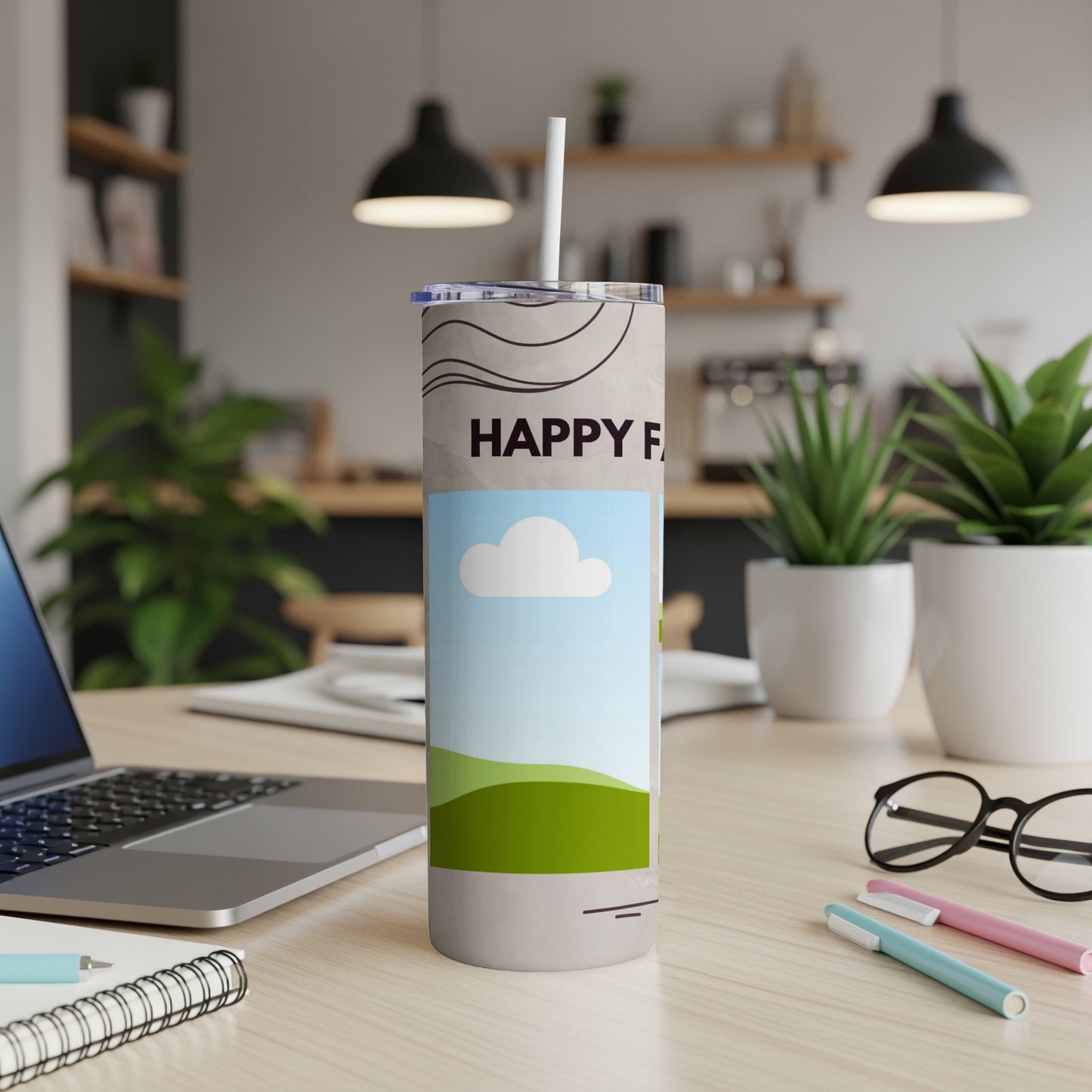 Tumbler with "HAPPY F" text, white cloud, and green hills design.