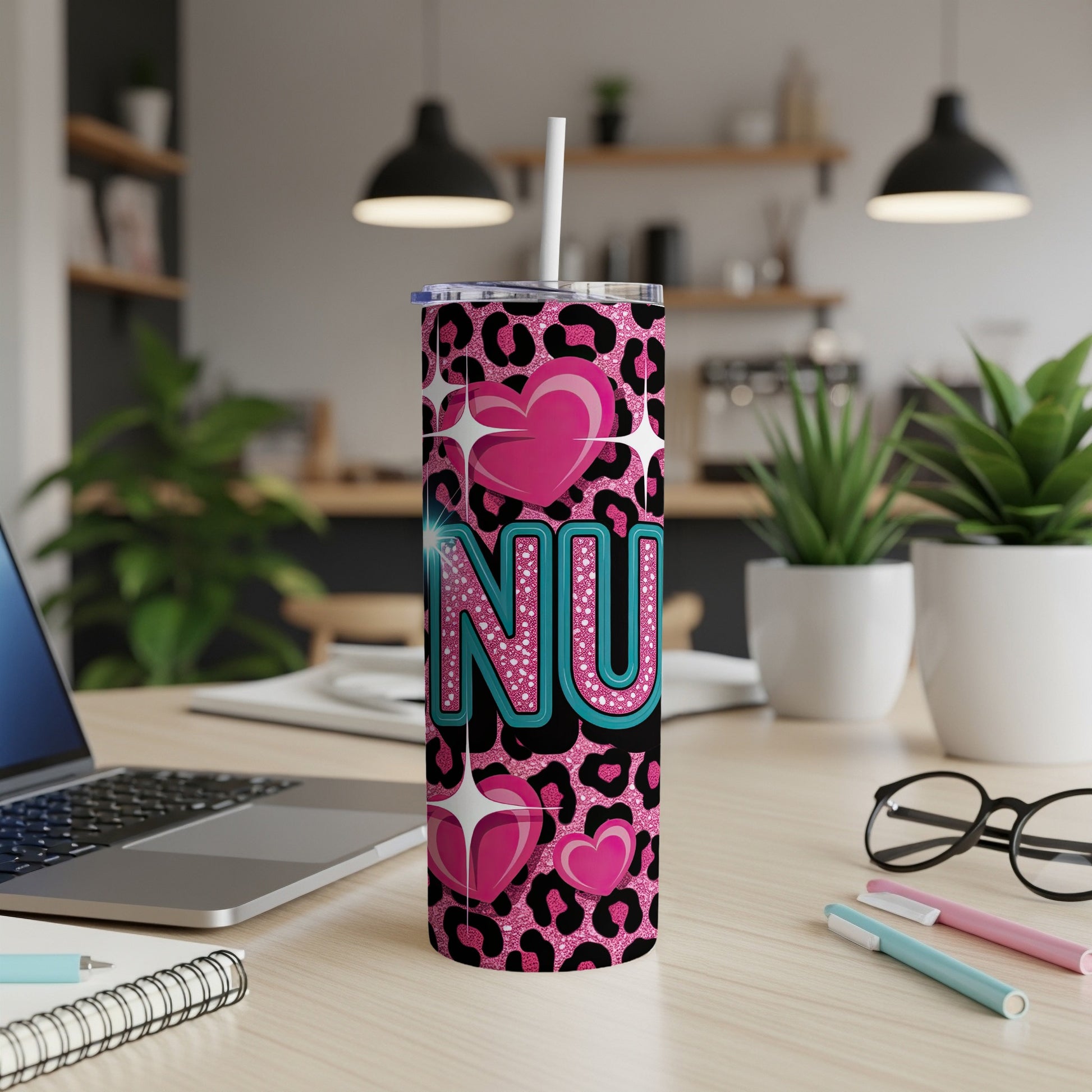 Tumbler with pink leopard print, "NU" in sparkly blue, and pink hearts.