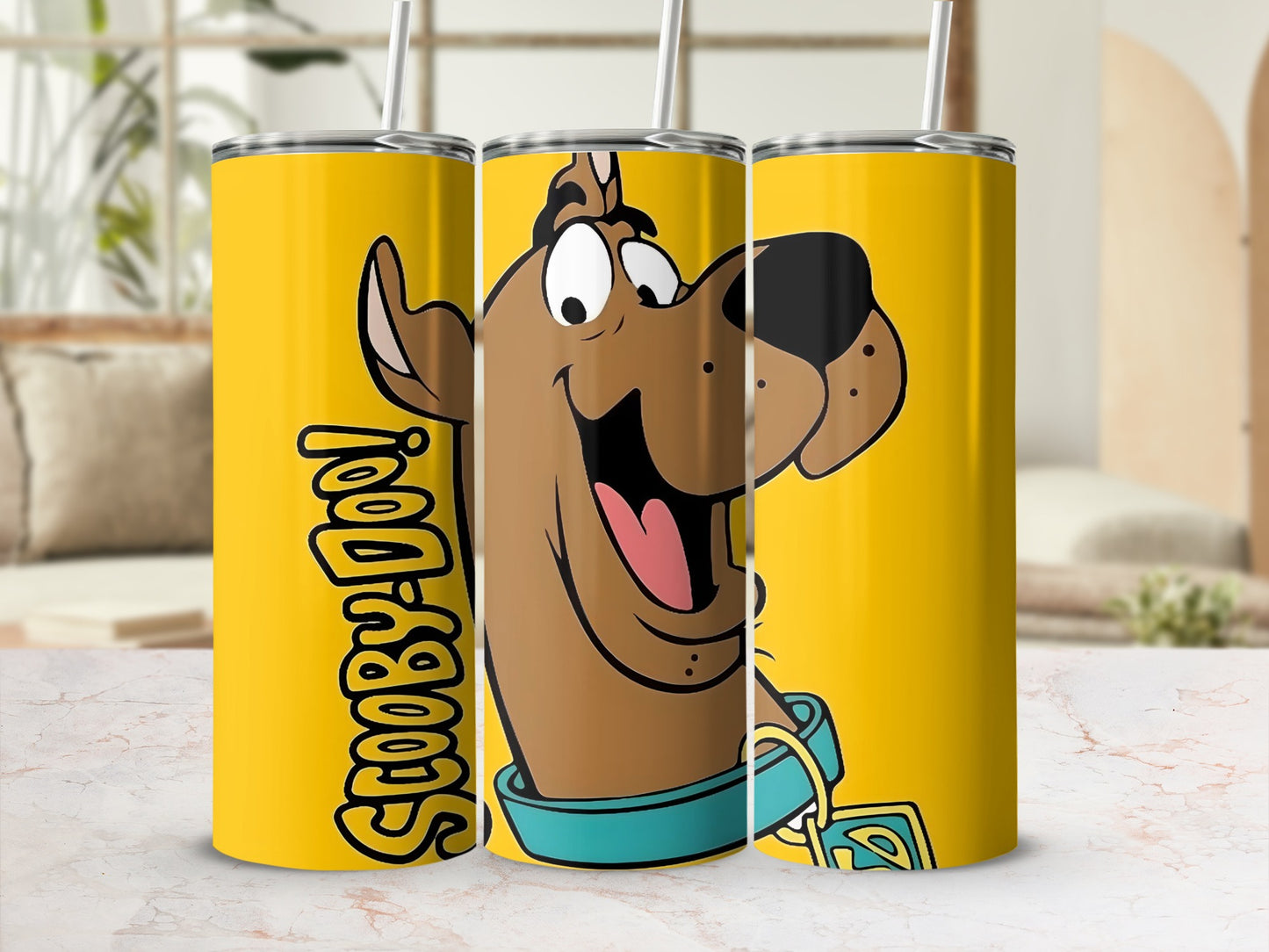 Yellow tumbler with Scooby-Doo cartoon graphic and text.