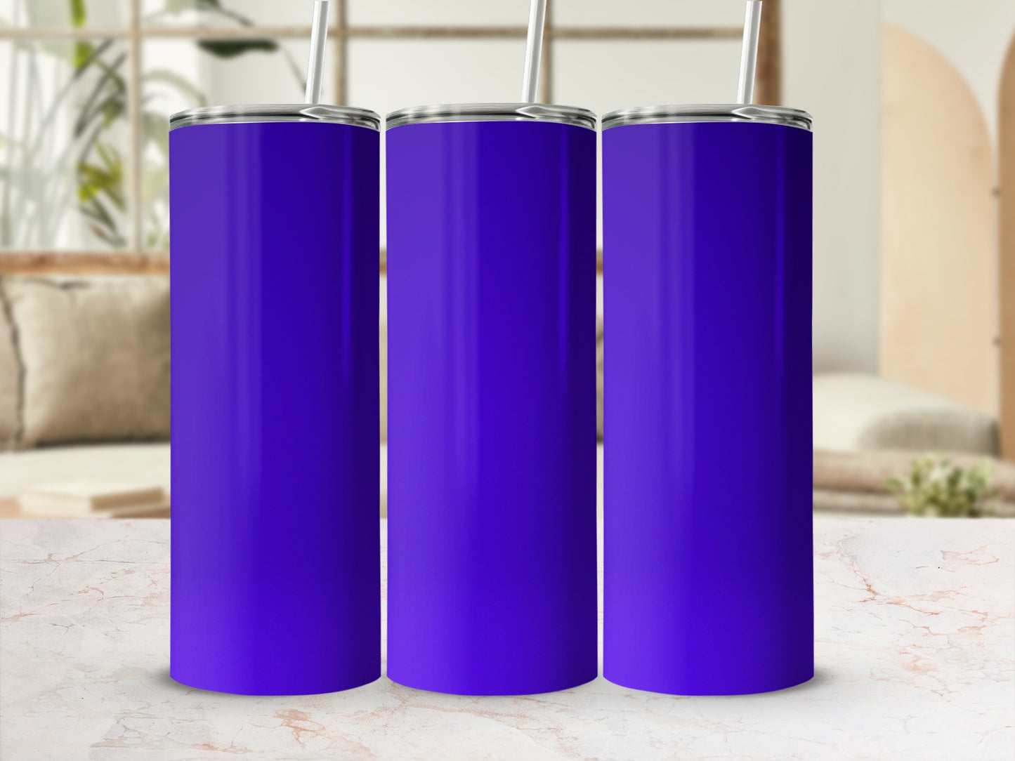 Three blank purple tumblers with straws on a marble surface.