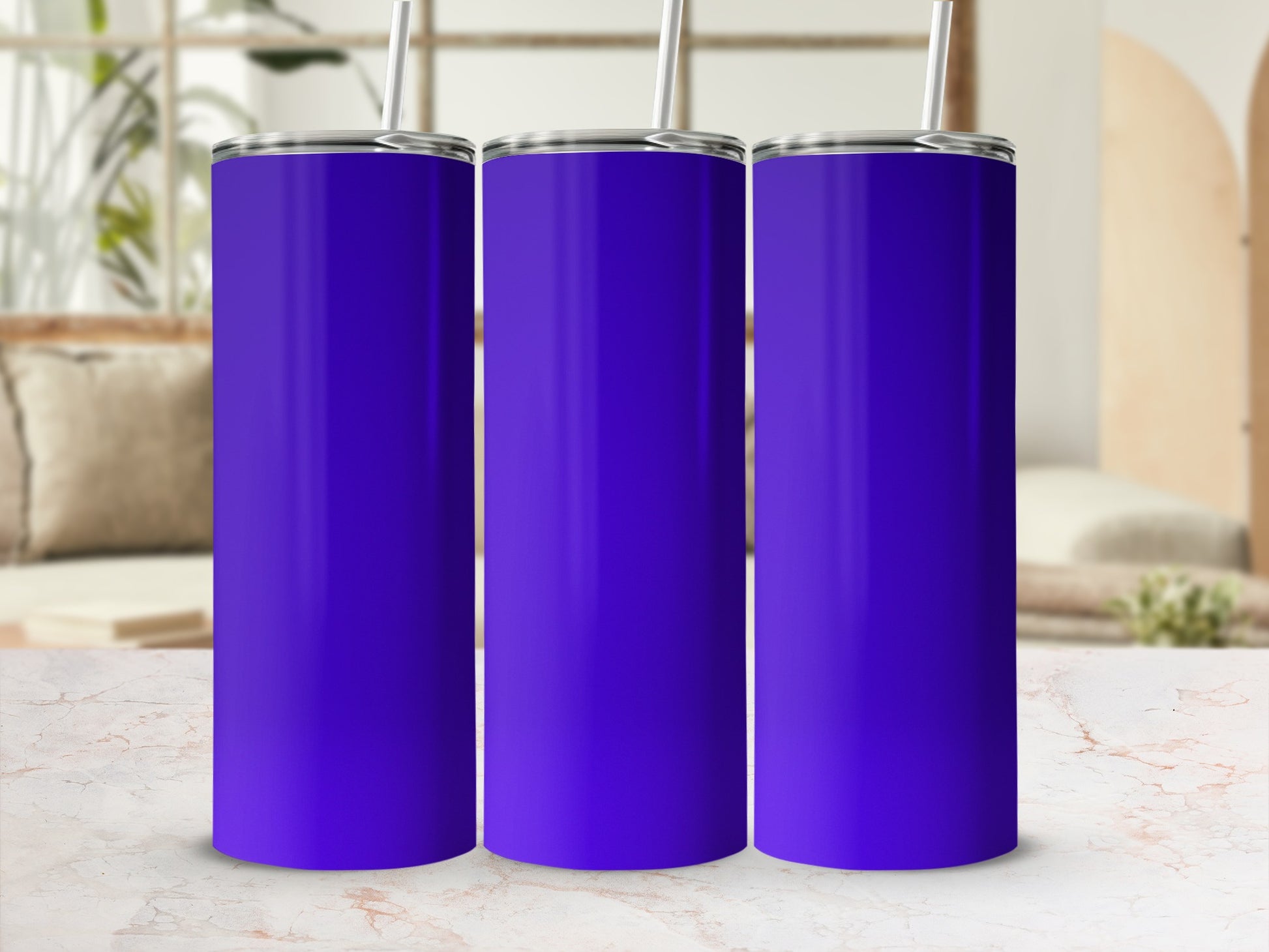 Three blank purple tumblers with straws on a marble surface.