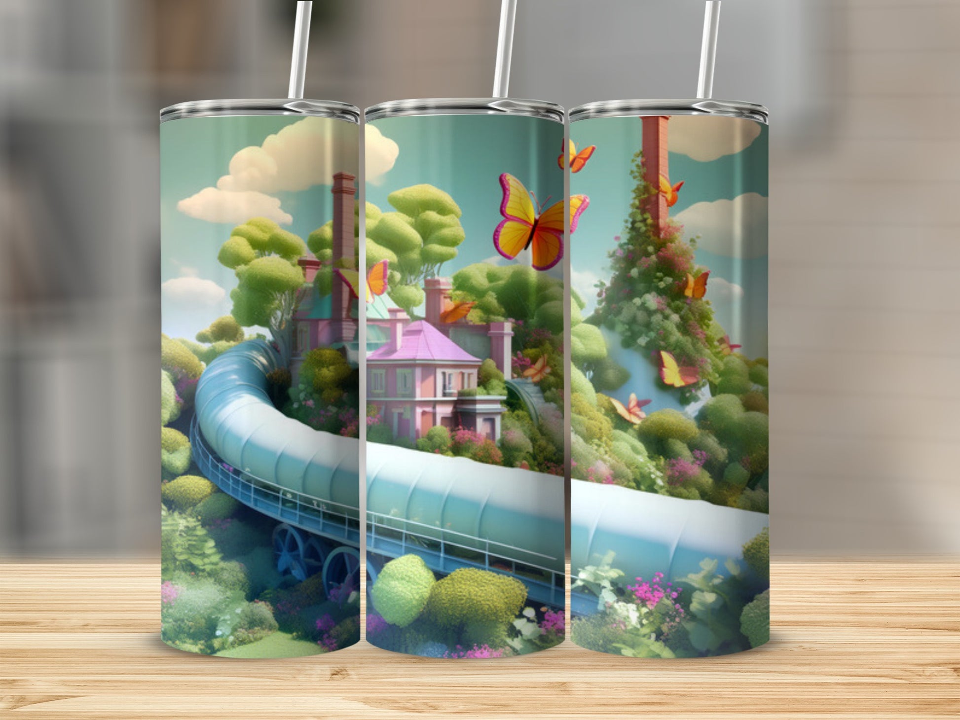 Three tumblers with a whimsical landscape and butterflies design.