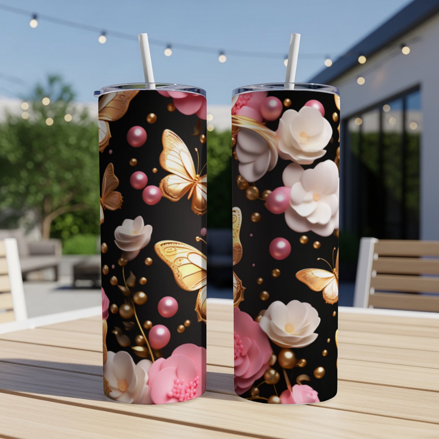 Black tumbler with gold butterflies, pink flowers, and pearls.