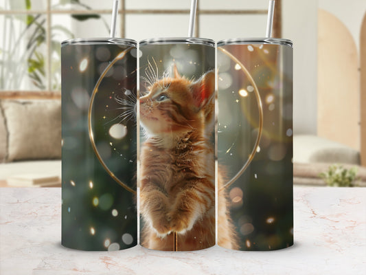 Three tumblers with a ginger kitten looking up, surrounded by golden light.