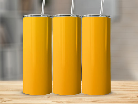Three tall, yellow tumblers with white straws on a wooden surface.