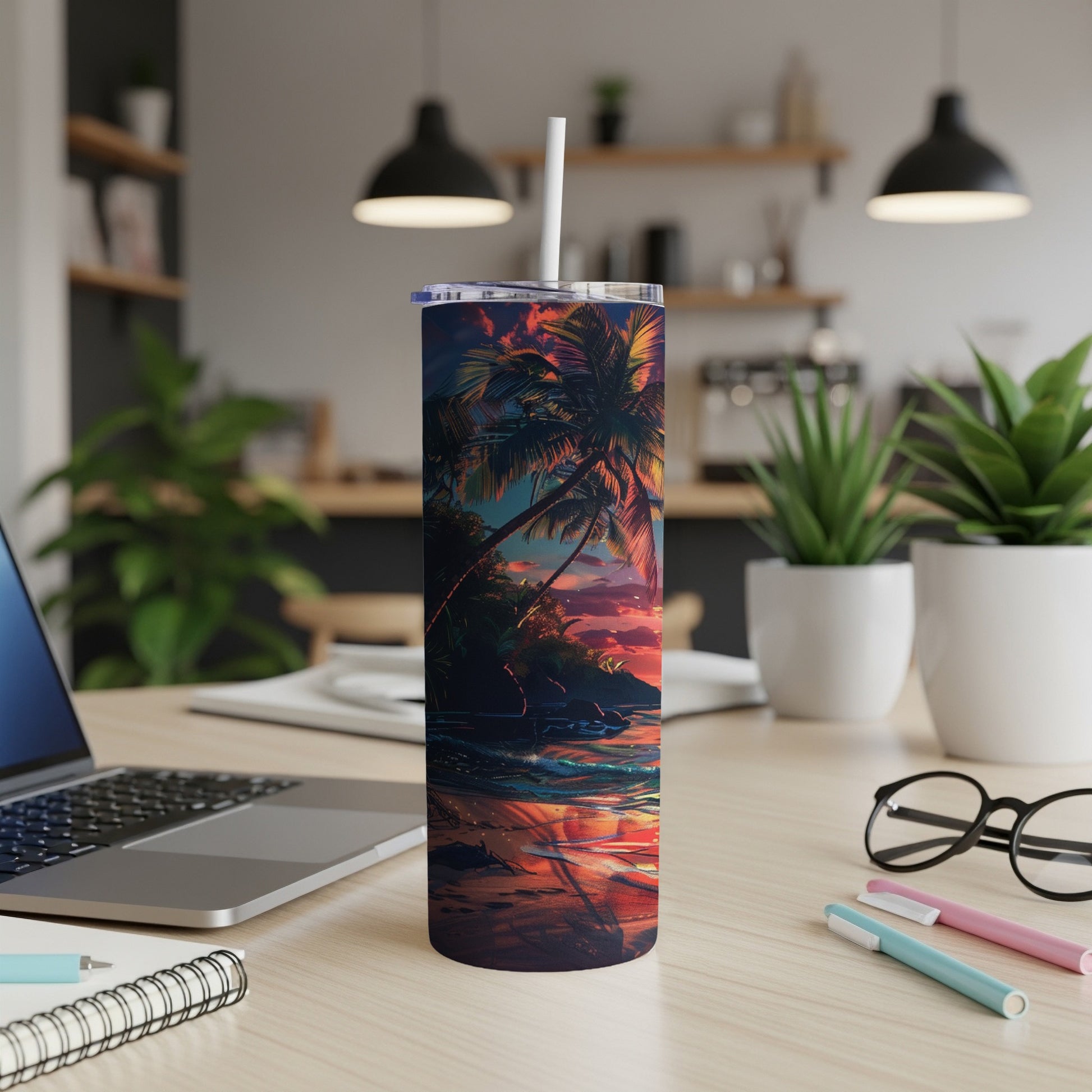 Tropical sunset on a beach with palm trees, depicted on a stainless steel tumbler.