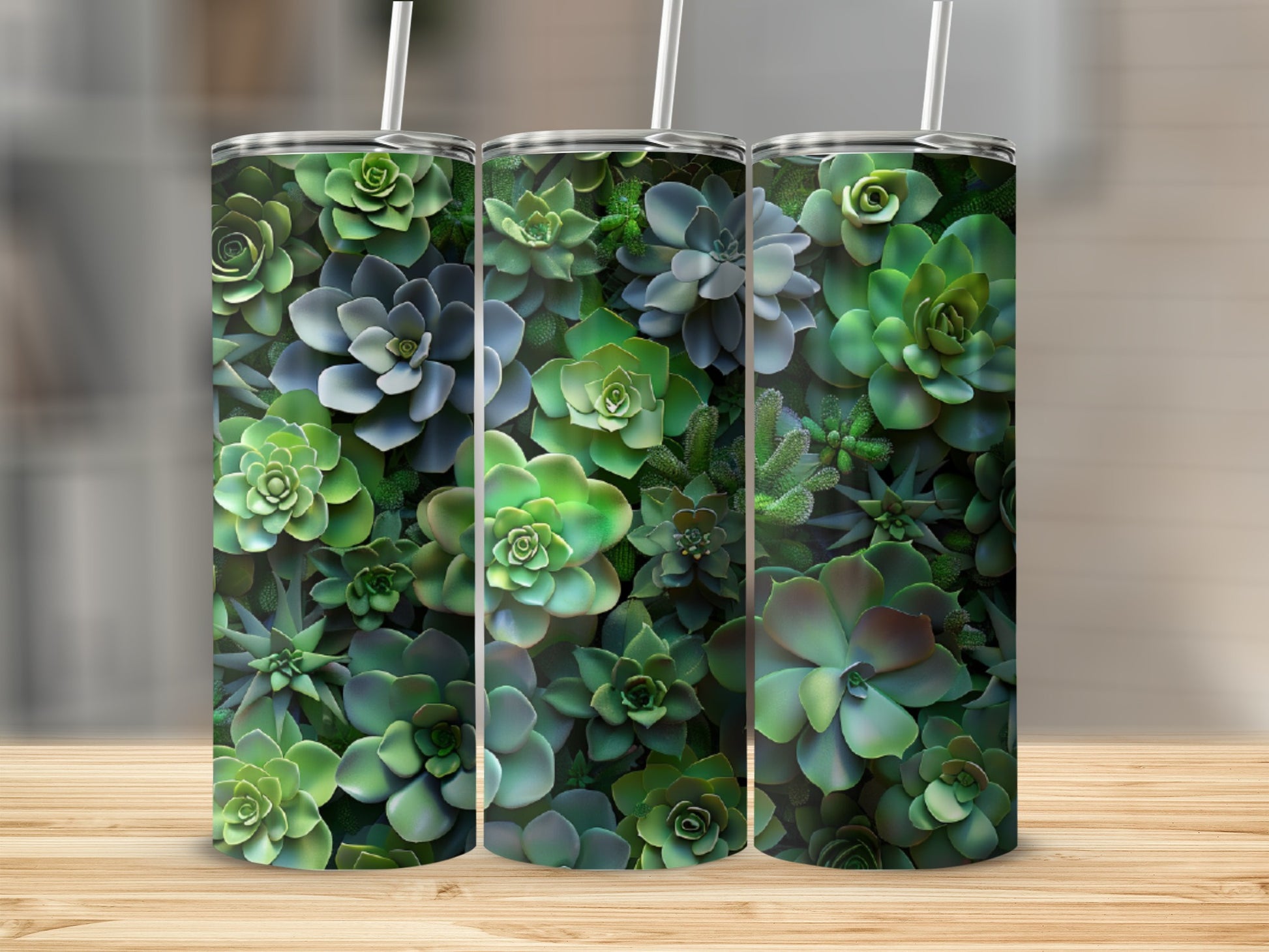 Three tumblers decorated with a pattern of lush green succulents.