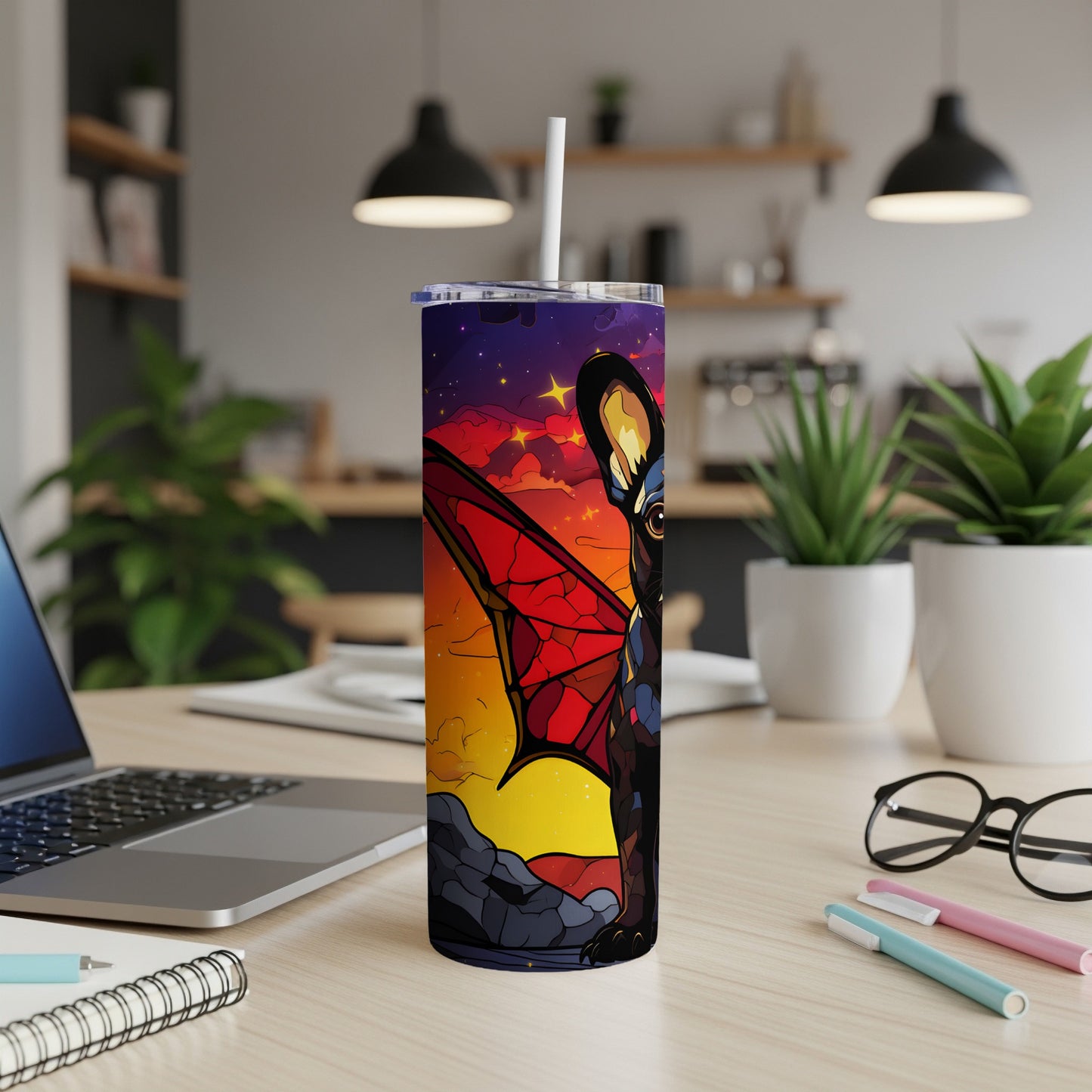 Tumbler with a French bulldog wearing bat wings against a colorful sunset sky.