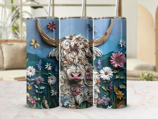 Highland cow and wildflowers on a blue tumbler.