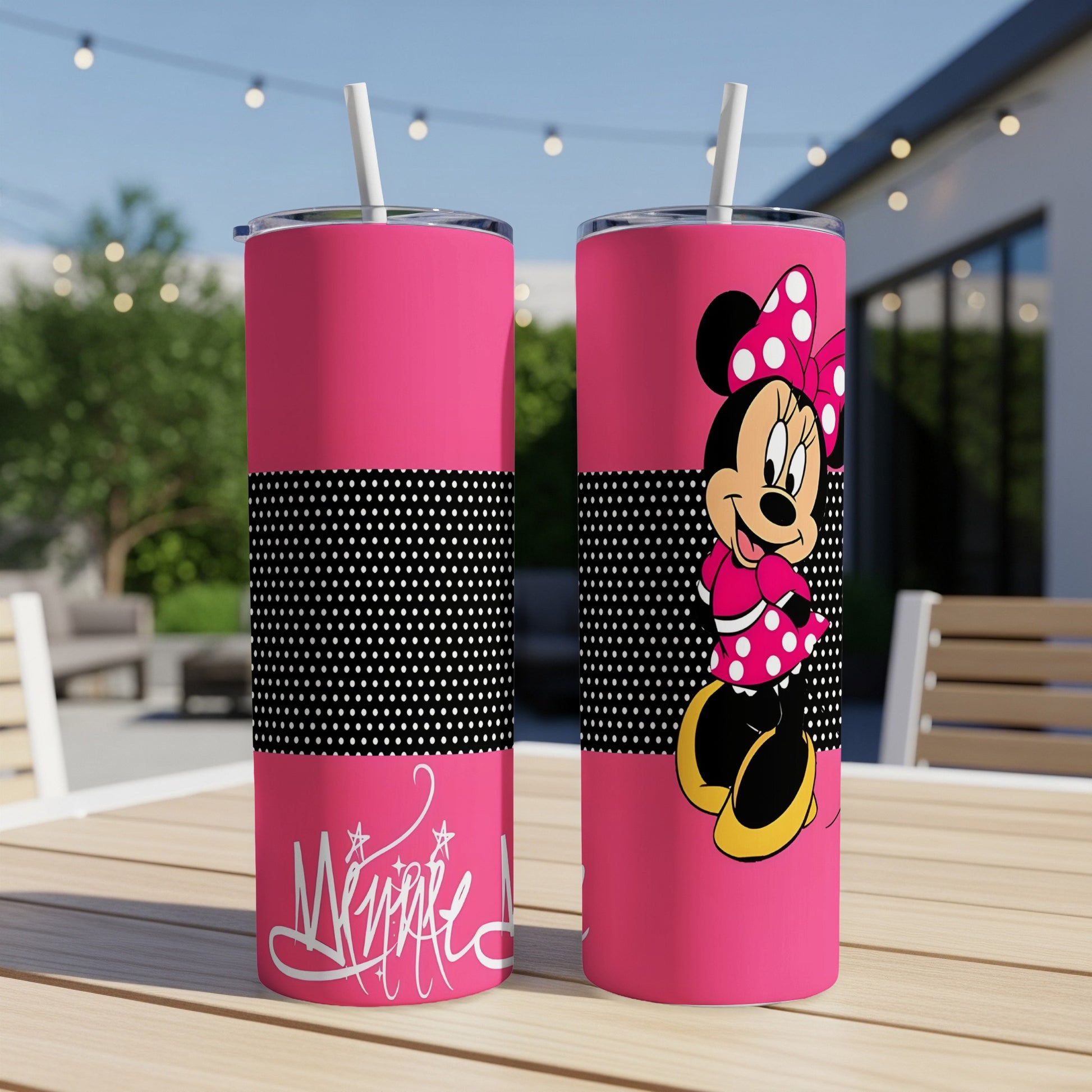 Pink tumbler with Minnie Mouse graphic and polka dot band.