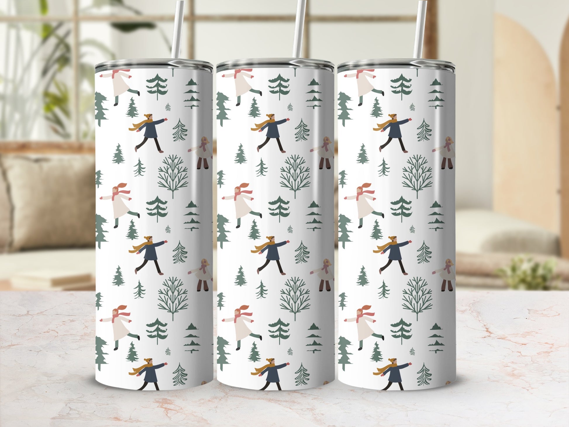Three tumblers with a repeating pattern of winter figures and trees.