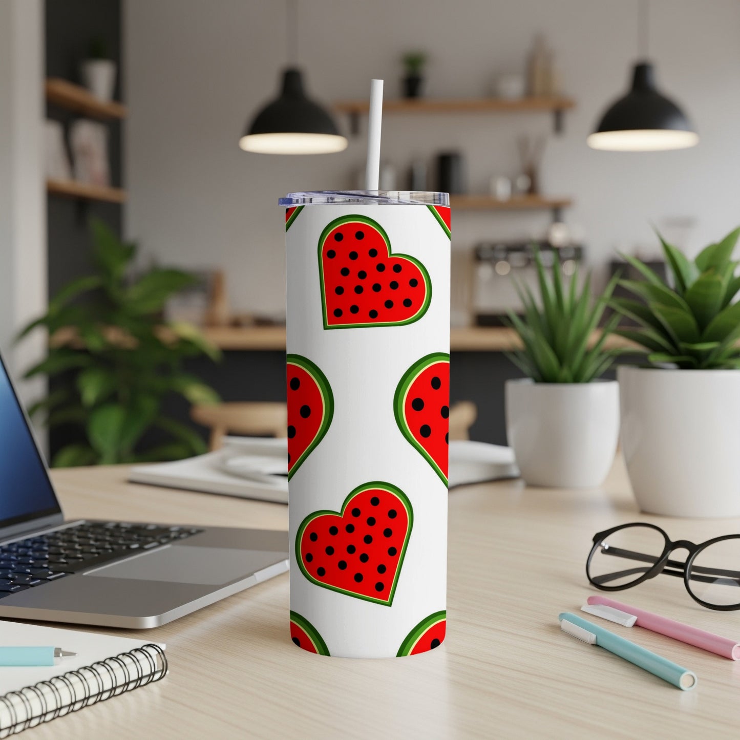 White tumbler with red hearts and watermelon seeds pattern.