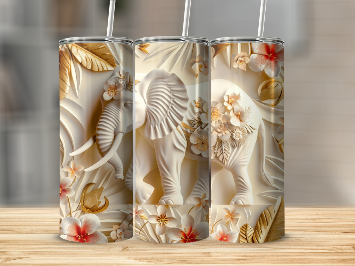 White embossed elephant with floral accents on a tumbler.