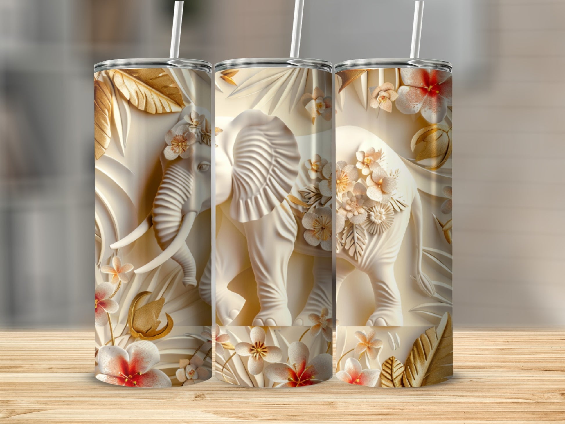 White embossed elephant with floral accents on a tumbler.