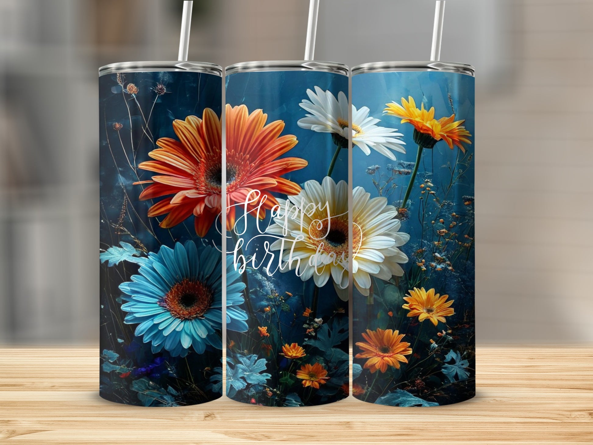 Three tumblers with floral designs and "Happy Birthday" text on dark blue background.