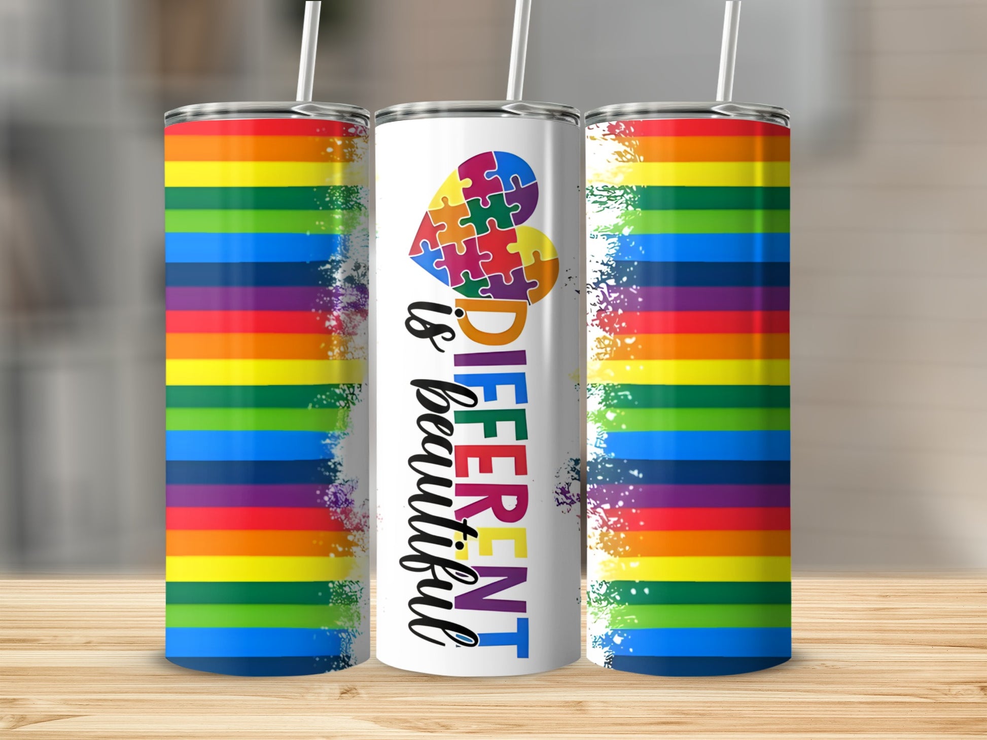 Rainbow tumbler with "Different is beautiful" text and heart puzzle piece design.