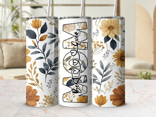 "Best Mom" text on a tumbler with a floral and botanical design.